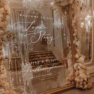 May include: A rustic wooden sign with the text "Welcome to our home" in white lettering. The sign features a distressed finish and a simple, inviting design, perfect for front door decor.