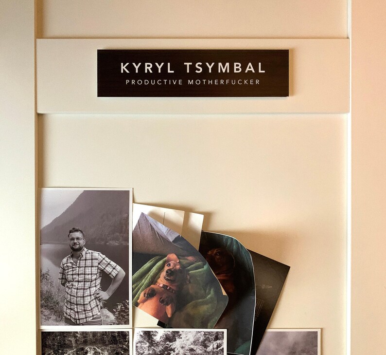 a collection of photographs, including a black and white image of a man, a black and white image of a dog, and a black and white image of a mountain. The name 'Kyryl Tsymbal' is displayed above the photographs.