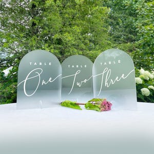 Arched Wedding Table Number Signs on Frosted Acrylic, Minimal Cursive Script Table Number Signage with Stand - GARDEN FORMAL