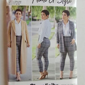 May include: A Simplicity sewing pattern envelope 8749 for Mimi G Style featuring three views of a person wearing a white button-down shirt and plaid trousers, paired with either a long tan coat or a matching plaid blazer. The text includes 8749 BB.