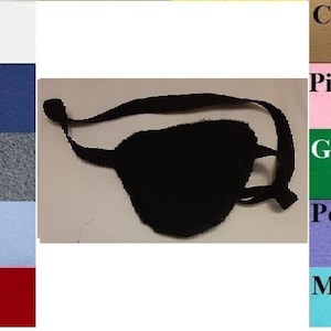 May include: A black eye patch with an elastic strap. The eye patch is made of soft fabric and is available in a variety of colors.