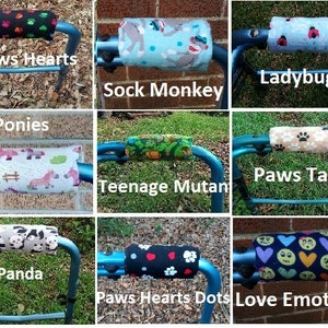 May include: Nine different walker handle covers with various colorful and patterned designs. The designs include paws, hearts, ladybugs, sock monkeys, ponies, teenage mutants, pandas, and love emotions.