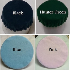 May include: Four felt circles in different colors: black, hunter green, blue, and pink. Each circle has the color name written in white text.
