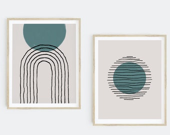 May include: Two framed abstract art prints with a minimalist design. The first print features a teal blue circle with a black and white striped arch underneath. The second print features a teal blue circle with black and white stripes around it.
