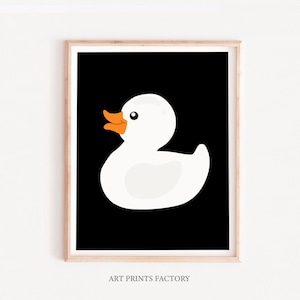 May include: A white rubber duck with an orange beak and feet on a black background.  Art Prints Factory.