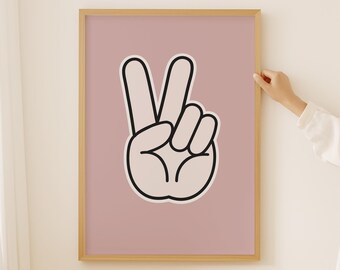 Op de afbeelding: Een ingelijst print met een roze achtergrond en een zwart-witte vredesduif-illustratie.