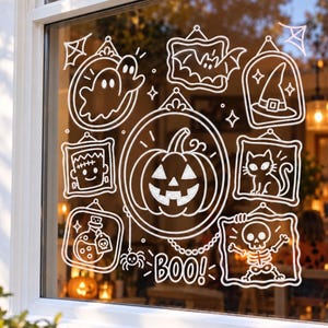 May include: A white window decal set featuring various Halloween-themed illustrations in frames, including a central jack-o'-lantern, ghosts, a bat, a witch hat, a cat, a potion bottle, and a skeleton, with the word BOO! printed at the bottom.