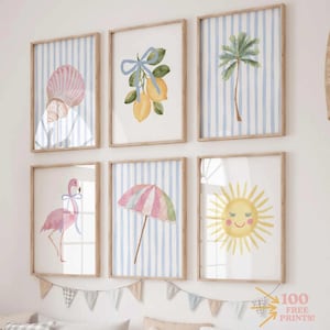 May include: Six framed watercolor prints with a coastal theme. The prints feature a seashell, lemons, a palm tree, a flamingo, a striped umbrella, and a smiling sun, all against a blue and white striped background. The frames are light brown.