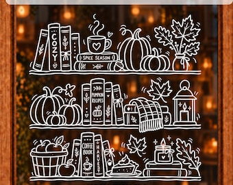 May include: A white line art window decal template featuring three shelves filled with autumn-themed illustrations including books labeled COZY, PUMPKIN RECIPES, COFFEE BOOK, and HARVEST, pumpkins, mugs, candles, leaves, and a pie. Text reads CHALK MARKER WINDOW TEMPLATE and PDF PRINTABLE FILE.