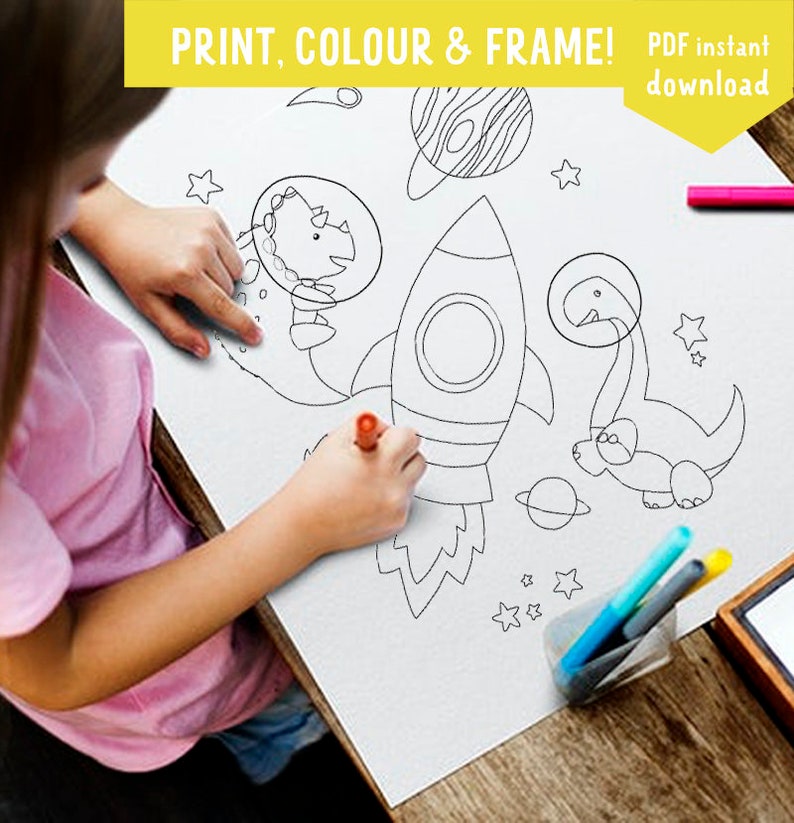 May include: A black and white printable coloring page featuring a rocket, two dinosaurs, stars, and planets.  The page is titled "PRINT, COLOUR & FRAME! PDF instant download".