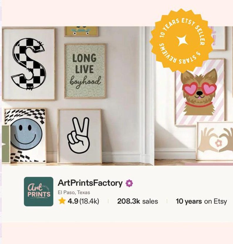 May include: A collection of framed wall art prints featuring a checkered letter S, a Long Live Boyhood sign, a blue smiley face, a peace sign hand gesture, a dog with heart-shaped glasses, and hands forming a heart shape, displayed on a wall.