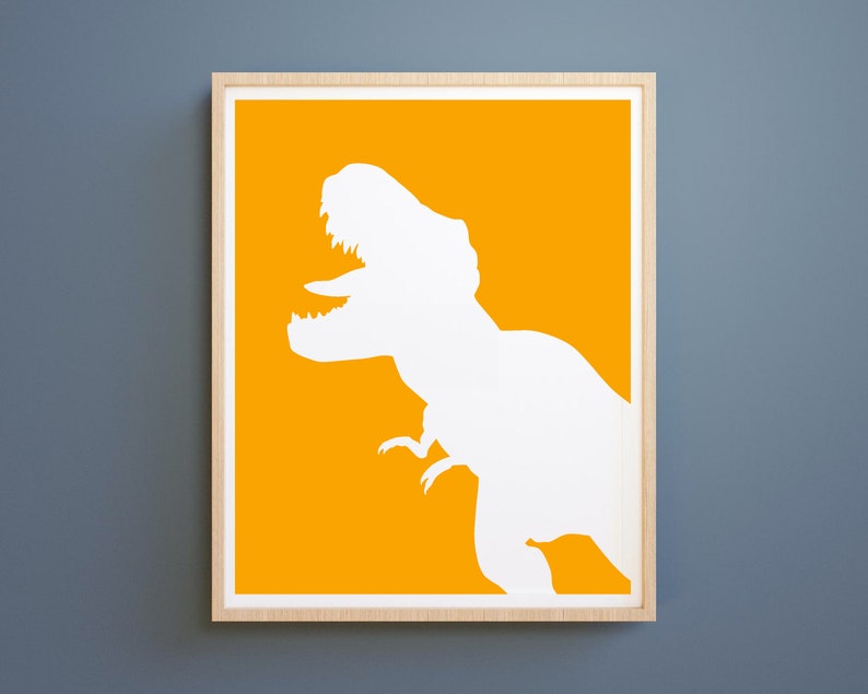 May include: A framed print with a white silhouette of a Tyrannosaurus Rex on a bright yellow background.
