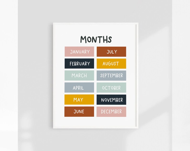 May include: A white printable chart with the word "MONTHS" in black text at the top. The chart lists the months of the year in black text on coloured rectangles. The colours are pink, dark blue, light green, light blue, yellow, dark blue, light green, light blue, yellow, dark brown, and pink.