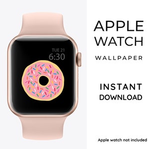 May include: A pink Apple Watch face with a donut design and the time 6:30. The text "TUE 21" is displayed above the donut. The watch face is on a rose gold Apple Watch.