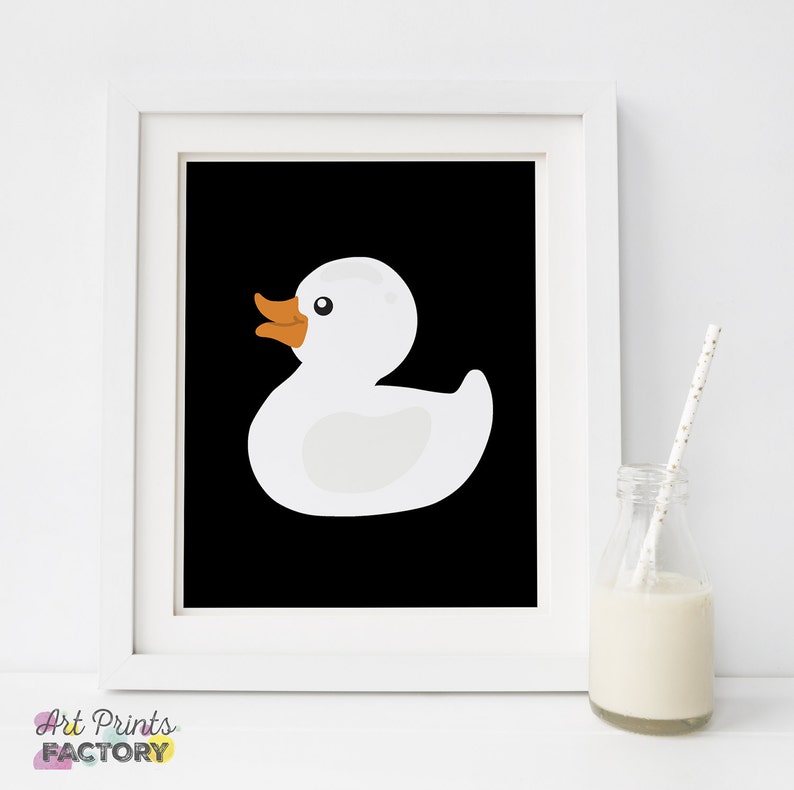 May include: A white rubber ducky on a black background. The ducky has a bright orange beak and feet.