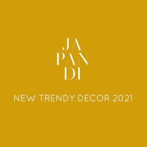 May include: A graphic design with the text "JAPANDI" in white on a yellow background. The text "NEW TRENDY DECOR 2021" is below the logo.