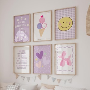 May include: A set of six framed wall art prints featuring various designs including a purple poster with white text reading You Are Beautiful Kind Strong & Loved, an ice cream cone, a yellow smiley face, positive affirmations, hearts, and a balloon dog.