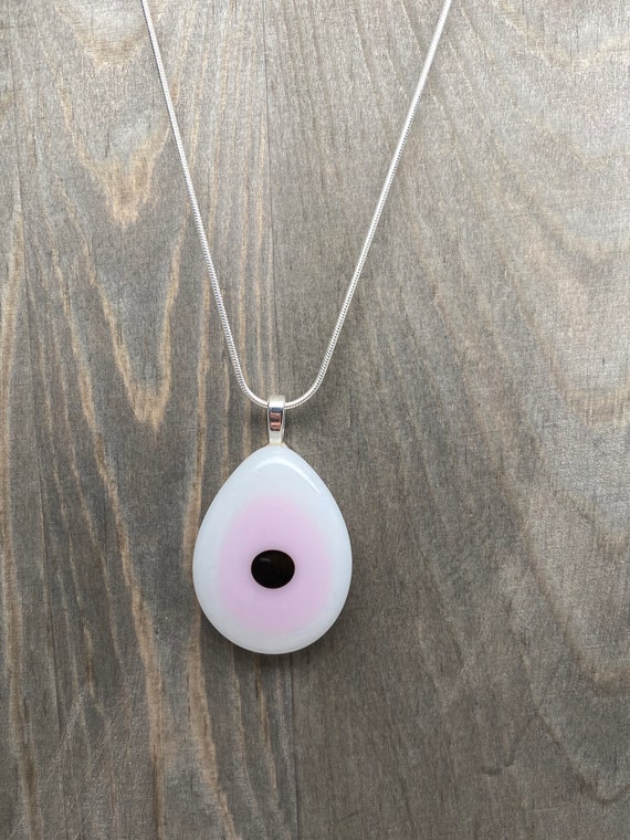 Pink evil eye best sale necklace