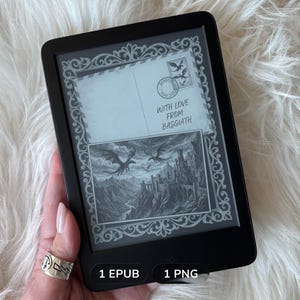 May include: Black e-reader displaying a grayscale illustration of dragons, a castle, and the text "WITH LOVE FROM BASGIATH." The e-reader is held in a hand with a silver ring. The screen shows a postcard design.