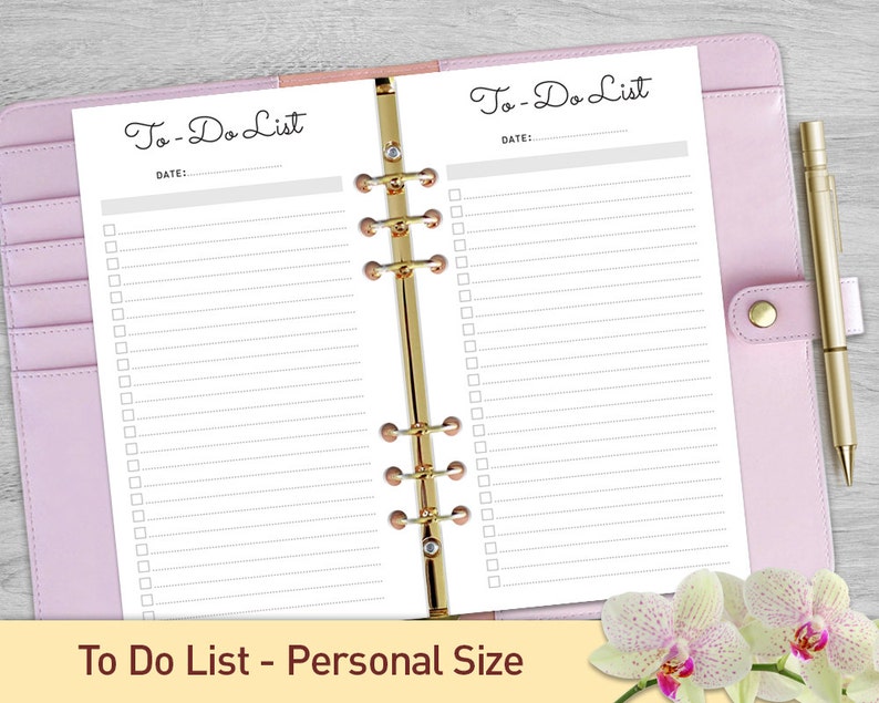 May include: A white to-do list planner with a pink binder and gold rings. The planner has two pages with the text "To-Do List" and "DATE:" at the top of each page. There are multiple checkboxes on each page.