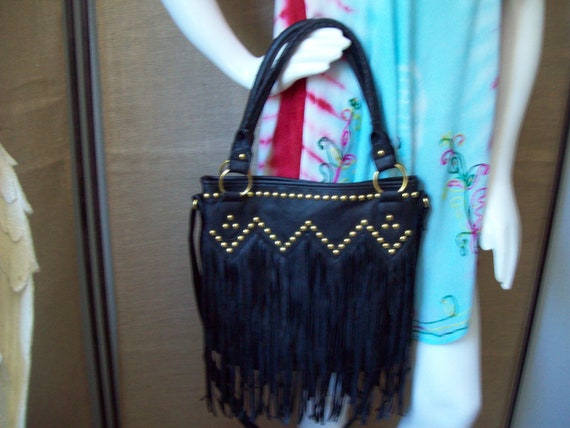 black purse with gold studs