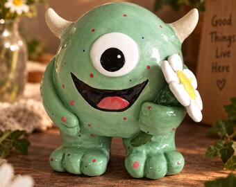 Handmade Ceramic Monster Figurine, Cute Cyclops Holding Flower, Ceramic Whimsical Shelf Decor, Cottagecore Gift, One Eyed Creature Art