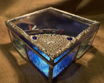 Iridescent small blue trinket box with a sparkly heart.