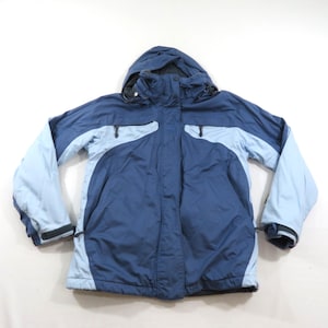 May include: A Helly Hansen winter jacket in dark blue and light blue. The jacket features a hood, a front zipper closure with a protective storm flap, long sleeves with adjustable cuffs, and two side pockets with dark zipper pulls.