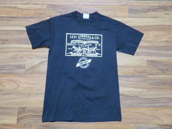 Vintage Levi's The Rivots Black T-shirt Sz M 50/50 - image 1