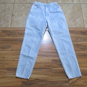 May include: Light blue denim jeans with a high waist and a straight leg.