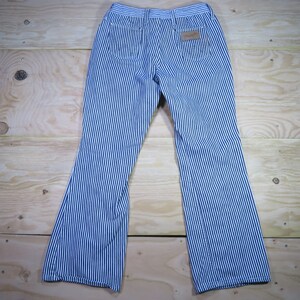 May include: Blue and white striped pants with a wide leg. The pants have a brown leather patch on the back right pocket.