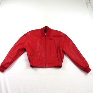 May include: A bright red leather bomber jacket featuring a full-length front zip, a ribbed knit collar, ribbed knit cuffs, and a ribbed knit hem. The jacket includes two vertical slit pockets on the front and long sleeves with a smooth finish.