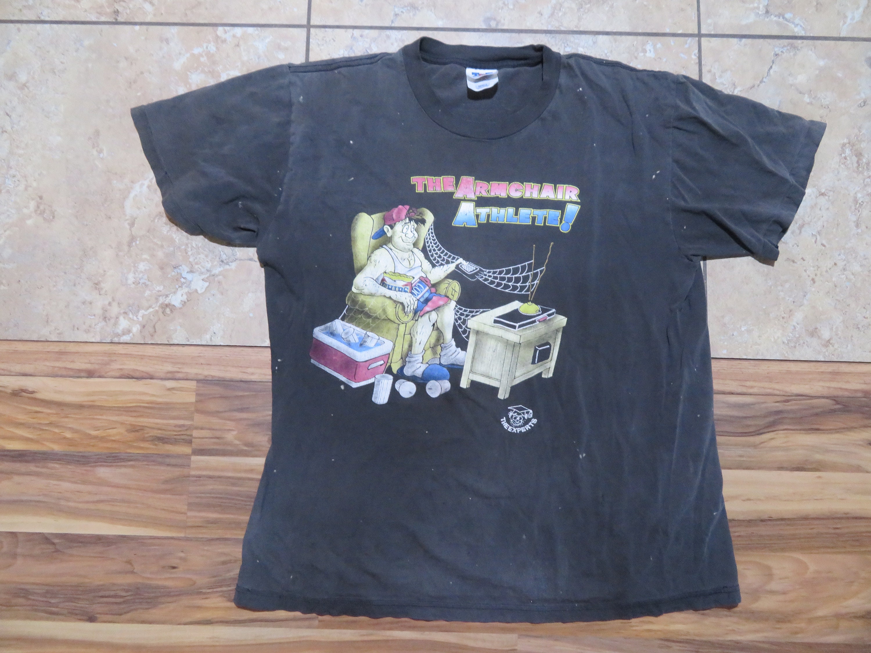 Vintage The Armchair Athlete Cartoon Style By the Experts TNT Brand Faded Black Distressed Color Look Sz L Divertente Comico