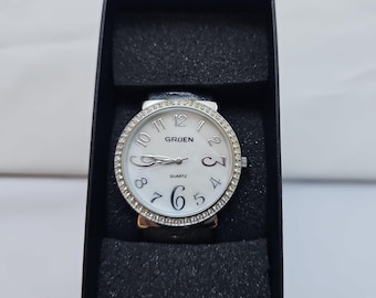 Orologio da polso da donna Gruen, cinturino rigido grigio, finiture in argento, quadrante bianco, al quarzo