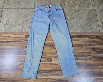 Vintage LEVIS 560 Zip-Fly Jeans Light Blue Wash Made in USA Tagged L 13 Loose Straight Leg Measured 32x33