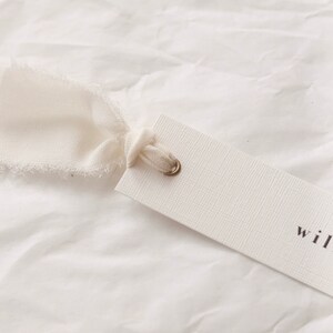 Modern place cards with ribbon attached, bold text escort cards, black and white name cards image 5