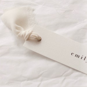Modern place cards with ribbon attached, bold text escort cards, black and white name cards image 8