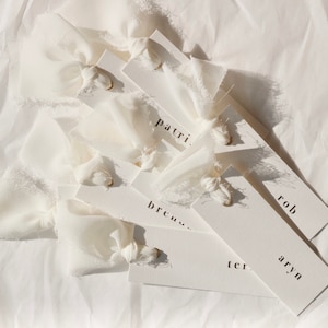 Modern place cards with ribbon attached, bold text escort cards, black and white name cards image 7