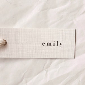 Modern place cards with ribbon attached, bold text escort cards, black and white name cards image 4