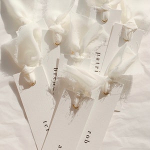 Modern place cards with ribbon attached, bold text escort cards, black and white name cards image 3