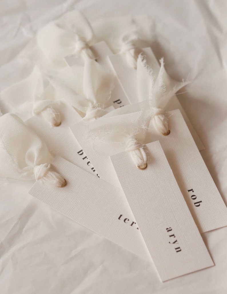 Modern place cards with ribbon attached, bold text escort cards, black and white name cards image 6