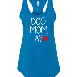 May include: A turquoise racerback tank top with the words "DOG MOM AF" in white, and a red heart graphic. The tank top has a scoop neck and a curved hemline.