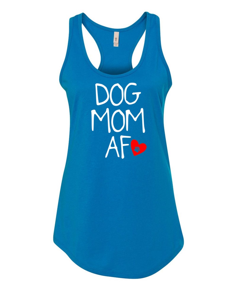 May include: A turquoise racerback tank top with the words "DOG MOM AF" in white, and a red heart graphic. The tank top has a scoop neck and a curved hemline.