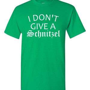 May include: Green t-shirt with white text that reads "I don't give a Schnitzel".