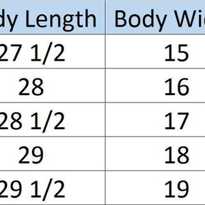 May include: Black racerback tank top with a curved hem. The image includes a size chart with body length and width measurements in inches for sizes S to XXL. The tank top is shown on a white background.