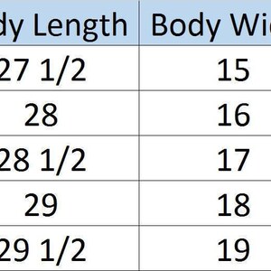 May include: Black racerback tank top with a rounded hem. The image includes a size chart with body length and width measurements in inches for sizes S to XXL.