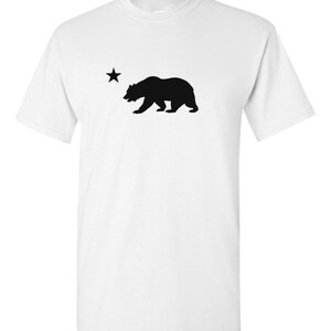 May include: White t-shirt with a black silhouette of a bear and a star, representing the California state flag.