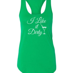 May include: A bright green racerback tank top with the phrase "I Like it Dirty" in white script and a martini glass graphic. The tank top has a scoop neck and a racerback design.