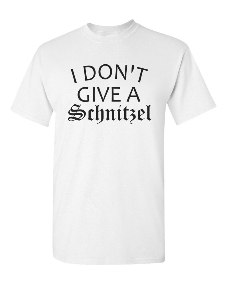 May include: White t-shirt with black text that reads "I don't give a Schnitzel".