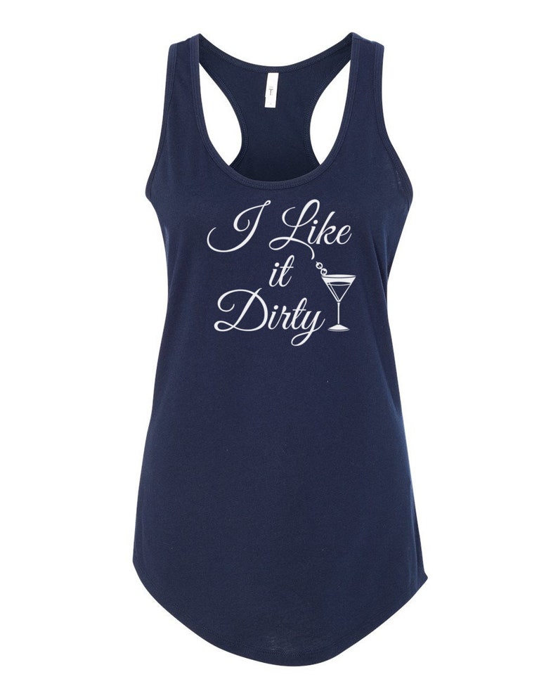 May include: Navy blue racerback tank top with the phrase "I Like it Dirty" in white script, accompanied by a martini glass illustration. The tank top has a scoop neck and a curved hemline.